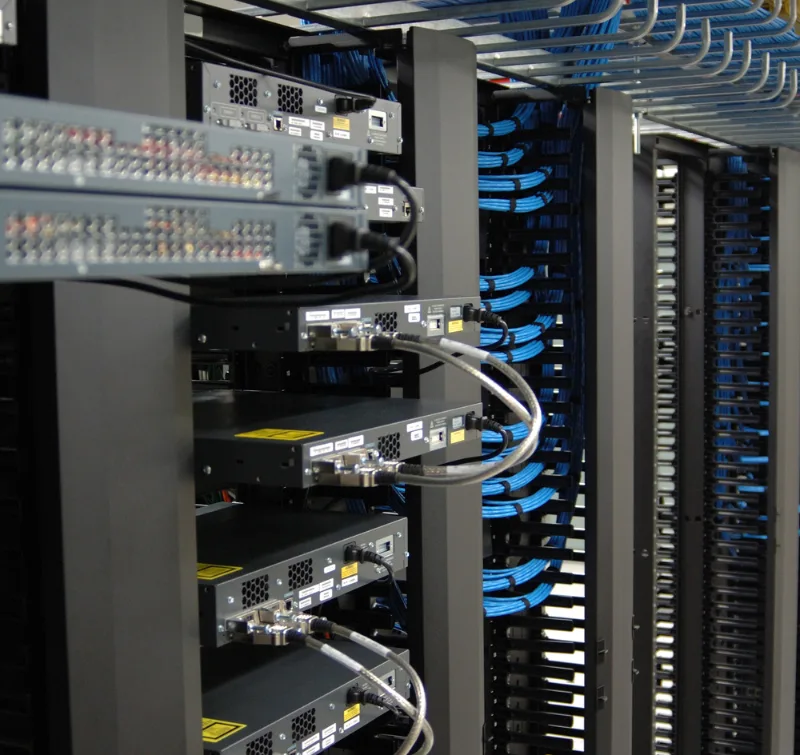 Server racks and structured network cabling inside a data center